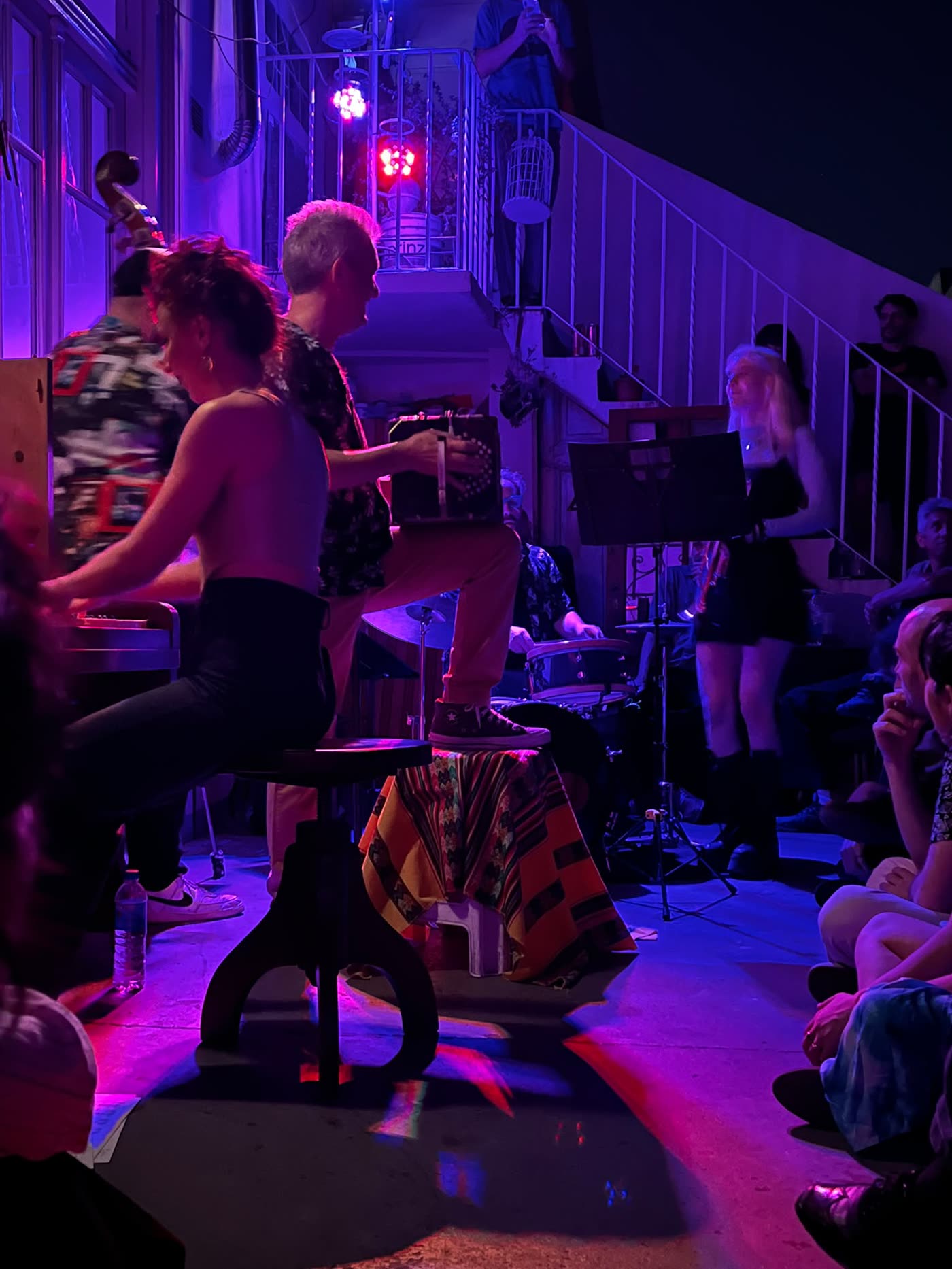 A live tango band playing piano, bandoneón and double bass